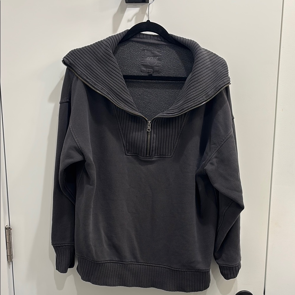 Women’s pullover zip sweater.